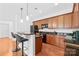 Modern kitchen with black appliances, granite countertops, and a convenient breakfast bar at 1903 Kenilworth Ave # 104A, Charlotte, NC 28203