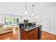Modern kitchen with stainless steel sink and open access to the living area at 1903 Kenilworth Ave # 104A, Charlotte, NC 28203
