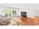 Spacious living room with modern entertainment setup and plenty of natural light at 1903 Kenilworth Ave # 104A, Charlotte, NC 28203