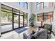 Bright lobby features large windows, modern tile flooring, black leather chairs, and indoor plants at 1903 Kenilworth Ave # 104A, Charlotte, NC 28203
