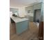 A modern kitchen featuring light green cabinetry, white countertops, and a spacious island at 1923 Fairfield Rd, Mount Gilead, NC 27306