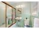 Vintage bathroom featuring mint tile, a glass shower door, and a classic sink at 1925 Montclair Ave, Gastonia, NC 28054
