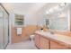 Retro pink bathroom featuring a shower, vanity, and floral wallpaper, combining vintage charm with function at 1925 Montclair Ave, Gastonia, NC 28054