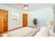 Light-filled bedroom featuring hardwood floors, a ceiling fan, and neutral décor at 1925 Montclair Ave, Gastonia, NC 28054