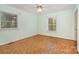 Empty bedroom filled with natural light highlights hardwood floors at 1925 Montclair Ave, Gastonia, NC 28054