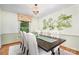 Elegant dining room featuring decorative wallpaper, chandelier lighting, and seating for six at 1925 Montclair Ave, Gastonia, NC 28054