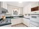 Charming kitchen showcasing white cabinetry, dark countertops, and modern fixtures at 1925 Montclair Ave, Gastonia, NC 28054
