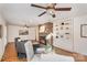 Open living room features hardwood floors, a brick fireplace, and built-in shelving for decor at 1925 Montclair Ave, Gastonia, NC 28054