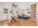 Inviting living room featuring hardwood floors, exposed brick, and ample natural light from the large window at 1925 Montclair Ave, Gastonia, NC 28054