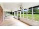 Bright, airy screened-in porch with dual ceiling fans, offering an ideal space to enjoy the outdoors at 1925 Montclair Ave, Gastonia, NC 28054
