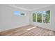Bright bedroom with multiple windows providing abundant natural light and treetop views at 209 Keswick Ave, Charlotte, NC 28206