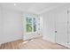 Bright bedroom with hardwood floors, a large window, and neutral paint at 209 Keswick Ave, Charlotte, NC 28206