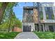 Modern townhouse with a garage, balcony, and contemporary design elements at 209 Keswick Ave, Charlotte, NC 28206