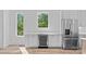 Bright kitchen featuring stainless steel appliances, wine cooler, and views from multiple windows at 209 Keswick Ave, Charlotte, NC 28206