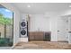 Laundry room with sink, beverage refrigerator, built-in cabinets, and exterior view at 209 Keswick Ave, Charlotte, NC 28206