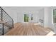 Bright, open living room features wood floors, modern fireplace, and sliding glass doors at 209 Keswick Ave, Charlotte, NC 28206