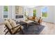 Bright living room with a cozy fireplace, modern furniture, and ample natural light streaming through the windows at 209 Keswick Ave, Charlotte, NC 28206