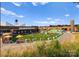 Large outdoor space with colorful seating areas and a water tower in the background at 209 Keswick Ave, Charlotte, NC 28206