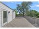 Spacious roof deck with tree view, gray deck tiles, and a white building exterior at 209 Keswick Ave, Charlotte, NC 28206