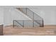 Contemporary staircase with wood treads and black metal railings, showcasing modern design at 209 Keswick Ave, Charlotte, NC 28206