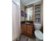 Bathroom with wood vanity, single sink, and shower with curtain at 2104 Farmbrook Dr, Statesville, NC 28625