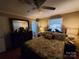 Cozy bedroom with a ceiling fan, dresser, and ensuite bathroom at 2104 Farmbrook Dr, Statesville, NC 28625
