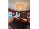 Cozy dining room featuring a wood table, ornate chandelier, and classic decor at 2104 Farmbrook Dr, Statesville, NC 28625