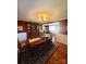 Warm and inviting dining room with a wood table, china cabinet, and living room access at 2104 Farmbrook Dr, Statesville, NC 28625