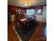 Traditional dining room with a wood table set for eight and classic decor at 2104 Farmbrook Dr, Statesville, NC 28625