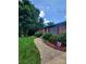 Charming brick home with a paved walkway leading to the front entrance at 2104 Farmbrook Dr, Statesville, NC 28625