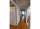 Hallway features gleaming wood floors and neutral wall paint at 2104 Farmbrook Dr, Statesville, NC 28625