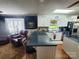 Open kitchen with granite countertop, stainless steel appliances, and barstool seating at 2104 Farmbrook Dr, Statesville, NC 28625