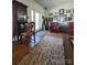Inviting living room featuring hardwood floors, antique furniture, and natural light at 2104 Farmbrook Dr, Statesville, NC 28625