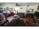 Spacious living room featuring hardwood floors, a cozy seating area, and ample natural light at 2104 Farmbrook Dr, Statesville, NC 28625