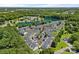 Aerial view featuring a lakefront community and its lush surrounding landscape at 218 Water Oak Dr, Pineville, NC 28134