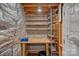 Utility room features wood table, shelving, and exposed wooden ceiling at 218 Water Oak Dr, Pineville, NC 28134