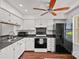 Functional kitchen with white cabinetry, modern appliances, and a ceiling fan at 218 Water Oak Dr, Pineville, NC 28134