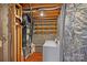 Functional laundry room with washer, dryer, and extra storage shelving at 218 Water Oak Dr, Pineville, NC 28134