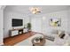 Bright living room features modern decor, hardwood floors, and plenty of natural light at 218 Water Oak Dr, Pineville, NC 28134