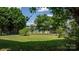 Well-maintained backyard with mature trees providing shade at 23 Redwood Ct, Alexander, NC 28601