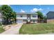 Charming split-level home with brick and vinyl siding, complemented by green shutters and a well-manicured lawn at 23 Redwood Ct, Alexander, NC 28601