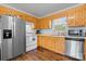 Well-equipped kitchen with stainless steel refrigerator, and a window for natural light at 23 Redwood Ct, Alexander, NC 28601
