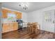 Cozy eat-in kitchen with natural wood cabinets, stainless steel appliances, and adjacent dining area at 23 Redwood Ct, Alexander, NC 28601