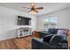Inviting living room with a large TV, comfortable sectional sofa, and stylish decor creating a relaxing atmosphere at 23 Redwood Ct, Alexander, NC 28601