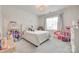 Charming bedroom with a chandelier, neutral paint, and large windows for natural light at 2324 Loire Valley Dr, Indian Land, SC 29707