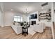 Spacious living room with a fireplace, built-in shelves, neutral-toned furniture, and access to the outdoors at 2324 Loire Valley Dr, Indian Land, SC 29707