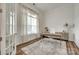 Well-lit office with a large window, sheer curtains, and modern desk setup at 2324 Loire Valley Dr, Indian Land, SC 29707
