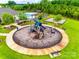 Community playground featuring modern equipment, benches, and a safe play surface at 2324 Loire Valley Dr, Indian Land, SC 29707