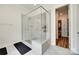 Modern shower with glass surround and a view into the walk-in closet at 2324 Loire Valley Dr, Indian Land, SC 29707