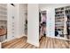 Well-organized walk-in closet with custom shelving, drawers, and ample storage for shoes and clothing at 2324 Loire Valley Dr, Indian Land, SC 29707